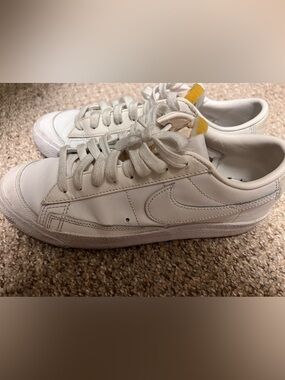 Nike White Low-Top Sneakers with Yellow Heel Accent